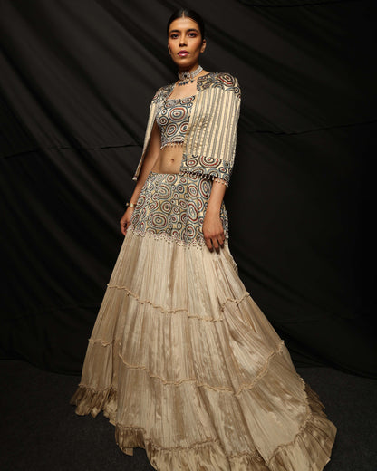 Cream Ajrakh embellished blouse and cape with layered lehenga.