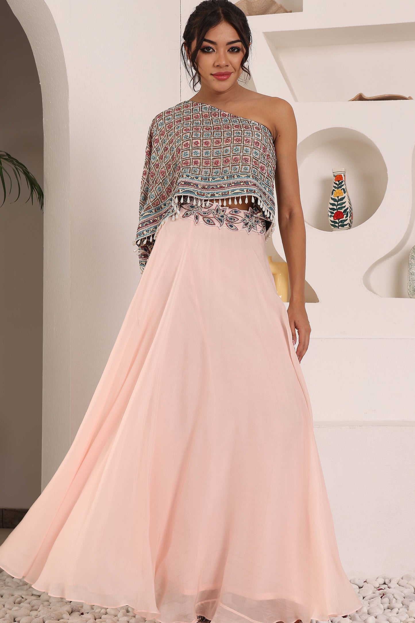 peachy pink ajrakh one shoulder top and pants set.