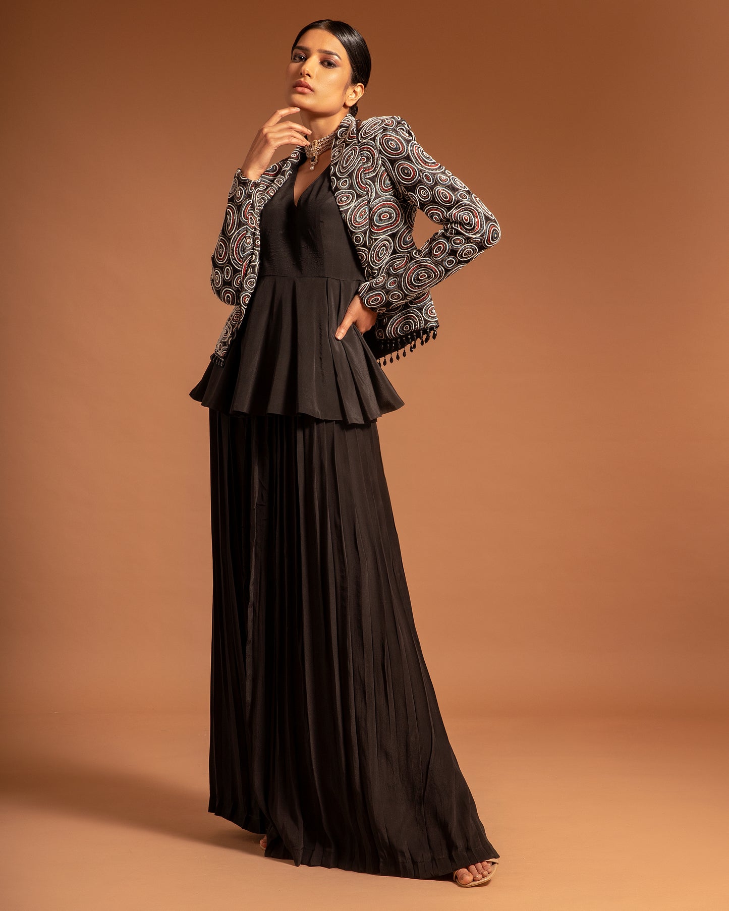 Black Ajrakh embellished jacket with black peplum top and pleated pants