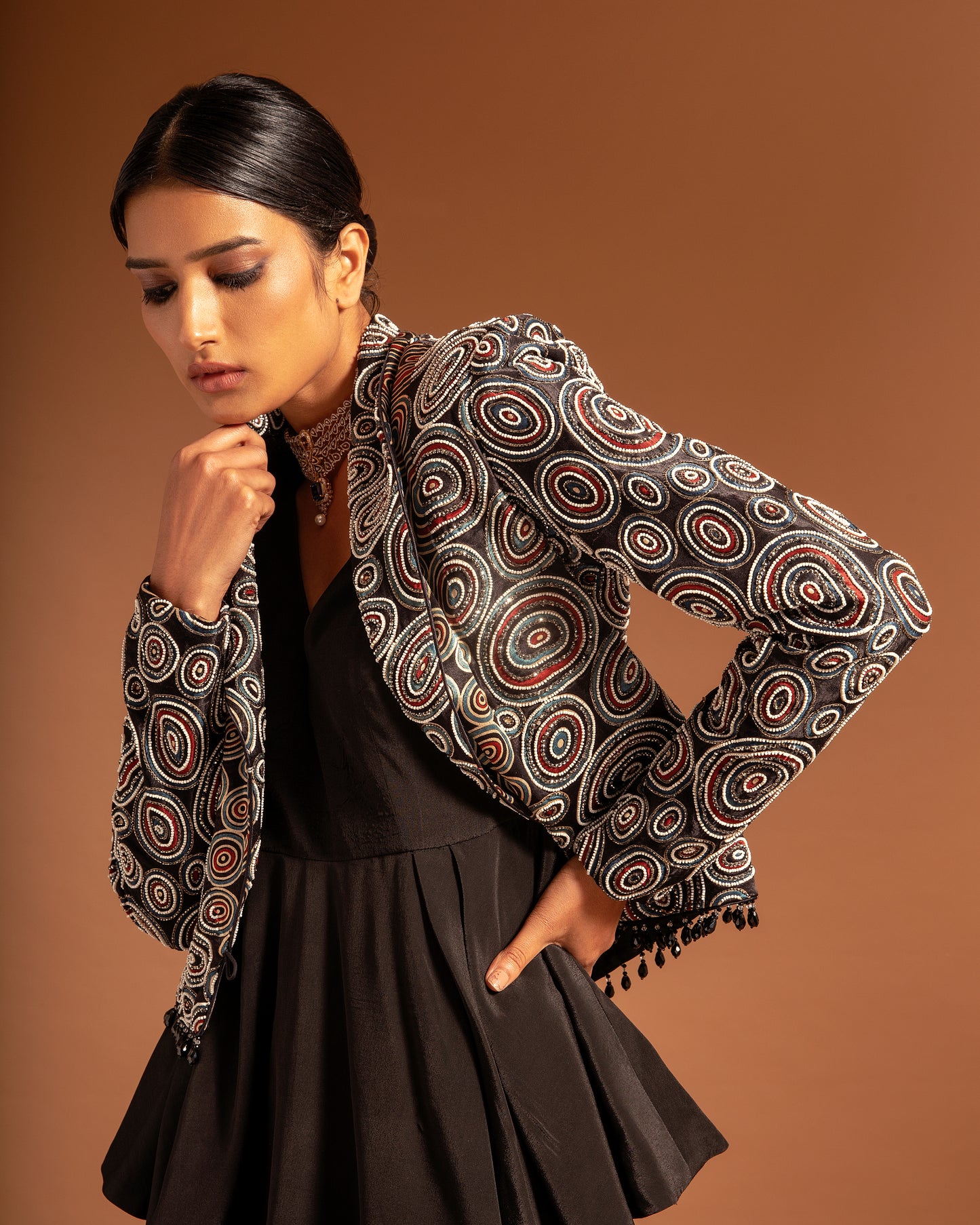 Black Ajrakh embellished jacket with black peplum top and pleated pants