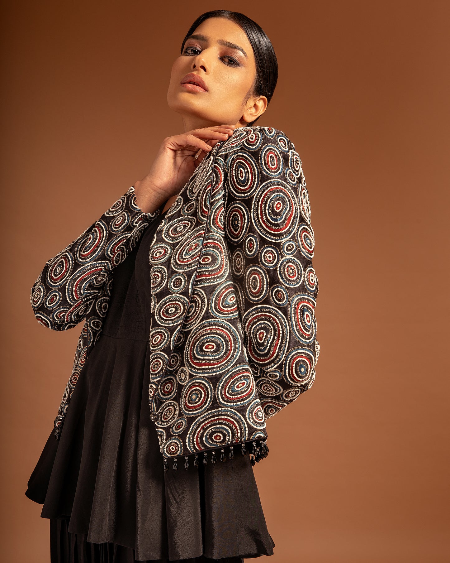 Black Ajrakh embellished jacket with black peplum top and pleated pants