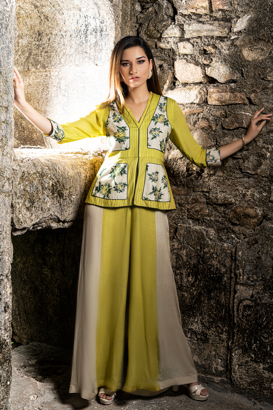 "Elevate your style with our ochre yellow peplum jumpsuit in crepe, featuring a chanderi bodice adorned with exquisite French knot and sequin detailing."