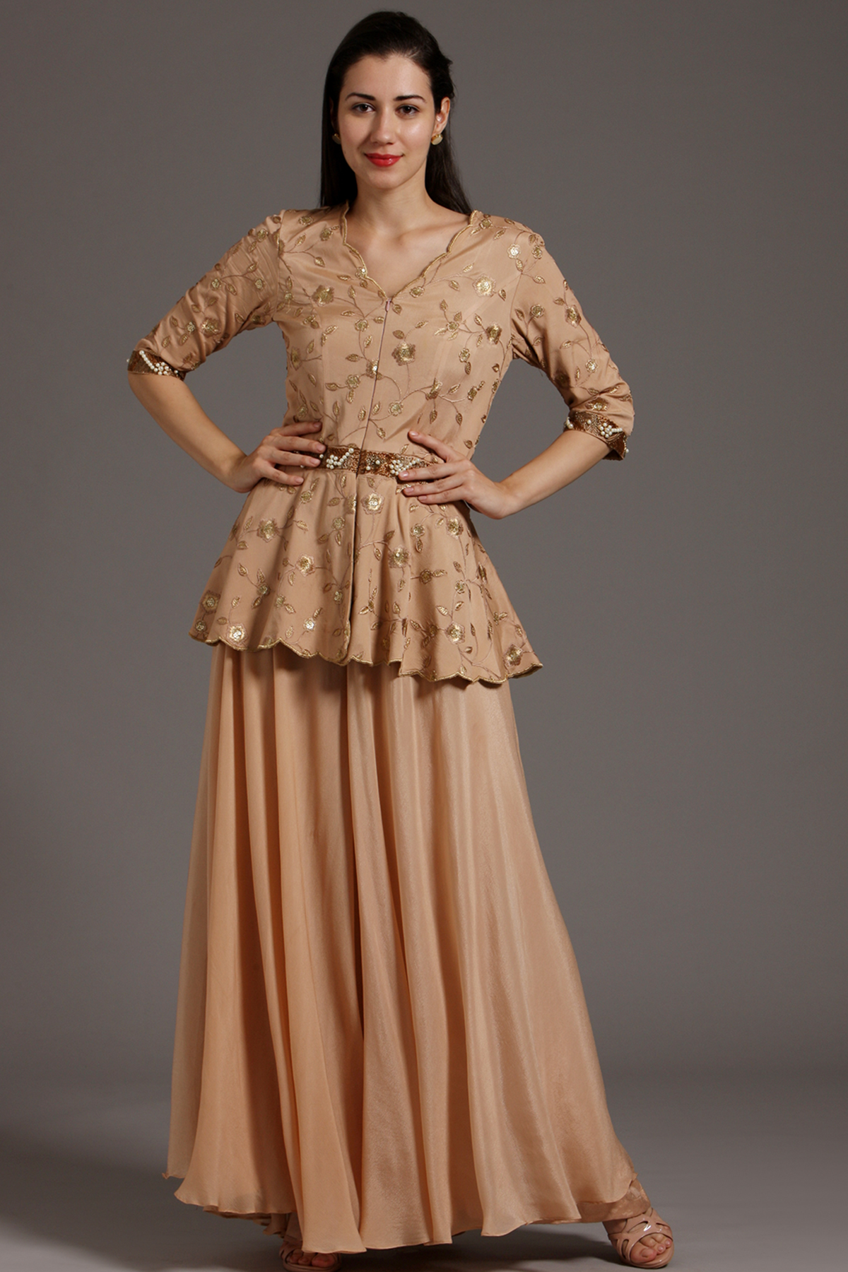 Peach crepe peplum jumpsuit with cutdana , pearl beads and threadwork embellishments.