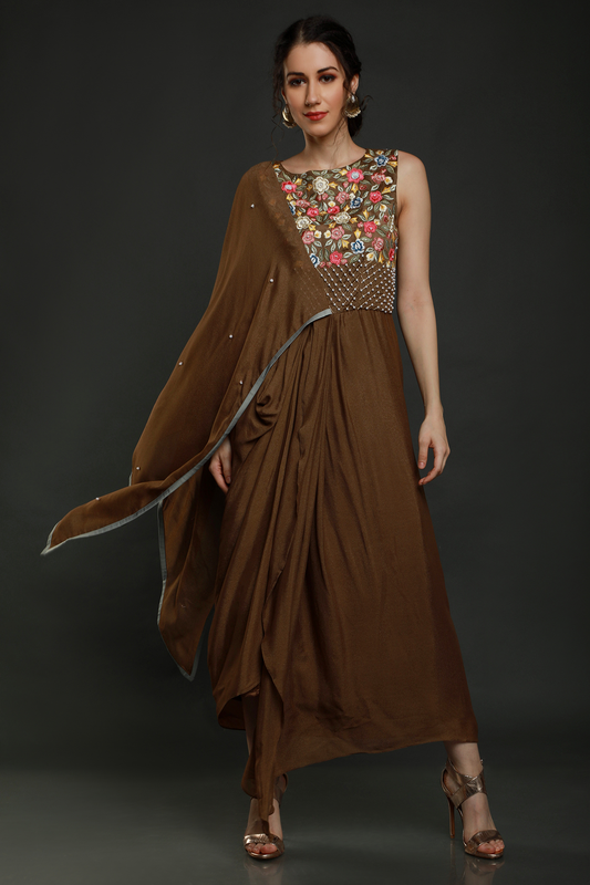 "Charming Tan Teddy Bear Crepe Dhoti Drape with Falling Pallu Sleeves, adorned with Thread, Cutdana, and Pearl Work Yoke. Shop this unique style!"