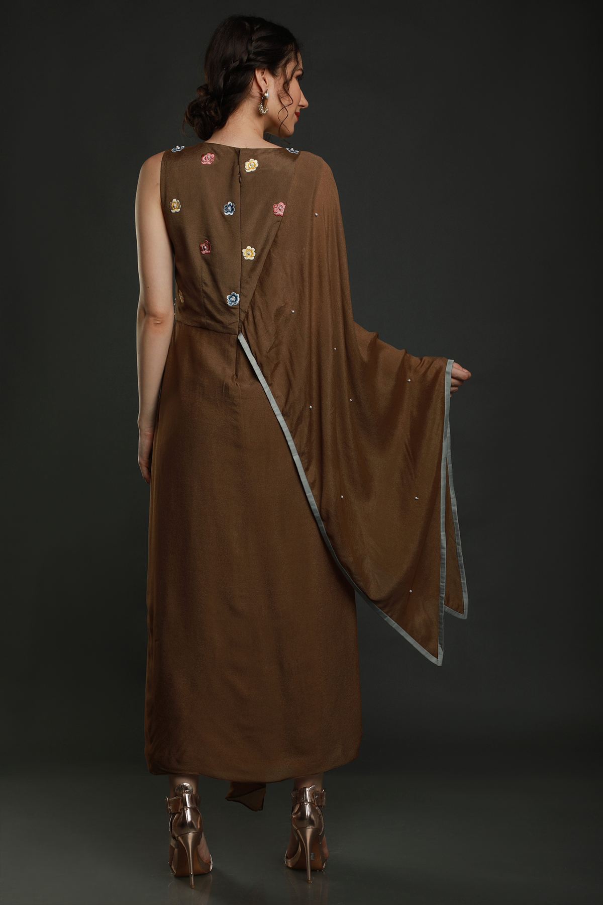"Charming Tan Teddy Bear Crepe Dhoti Drape with Falling Pallu Sleeves, adorned with Thread, Cutdana, and Pearl Work Yoke. Shop this unique style!"