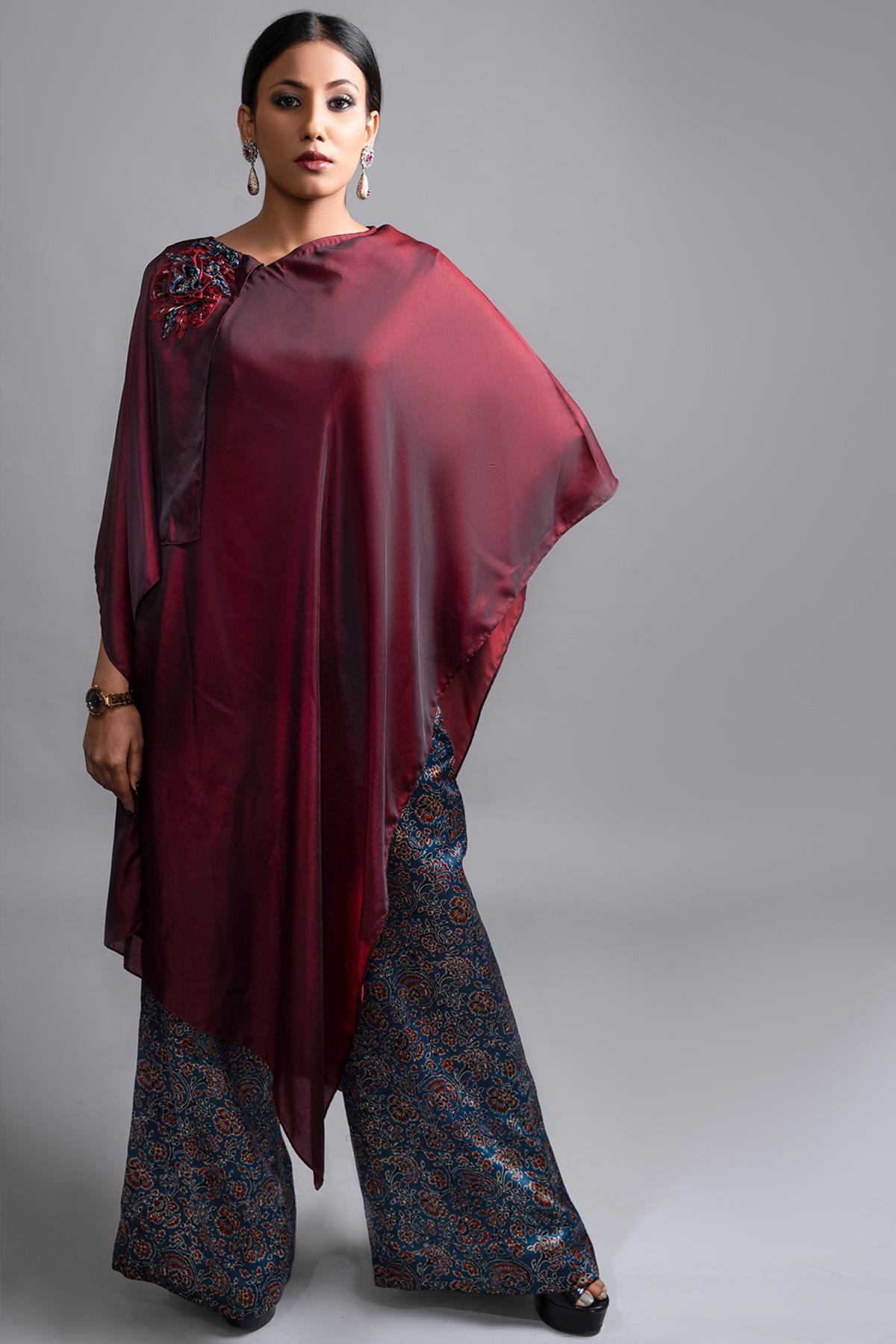 "Exquisite Drape Tunic in Pure Mashru Silk paired with Ajrak Pant in a perfect fusion ensemble. Embrace elegance with this timeless combination."