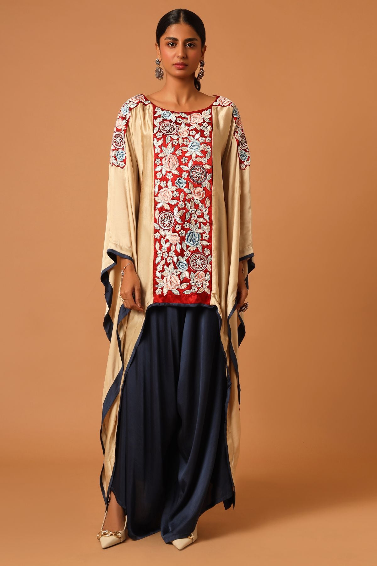 "Elevate your fashion with our asymmetrical handcrafted kaftan paired beautifully with flare pants. Discover unique style today!"