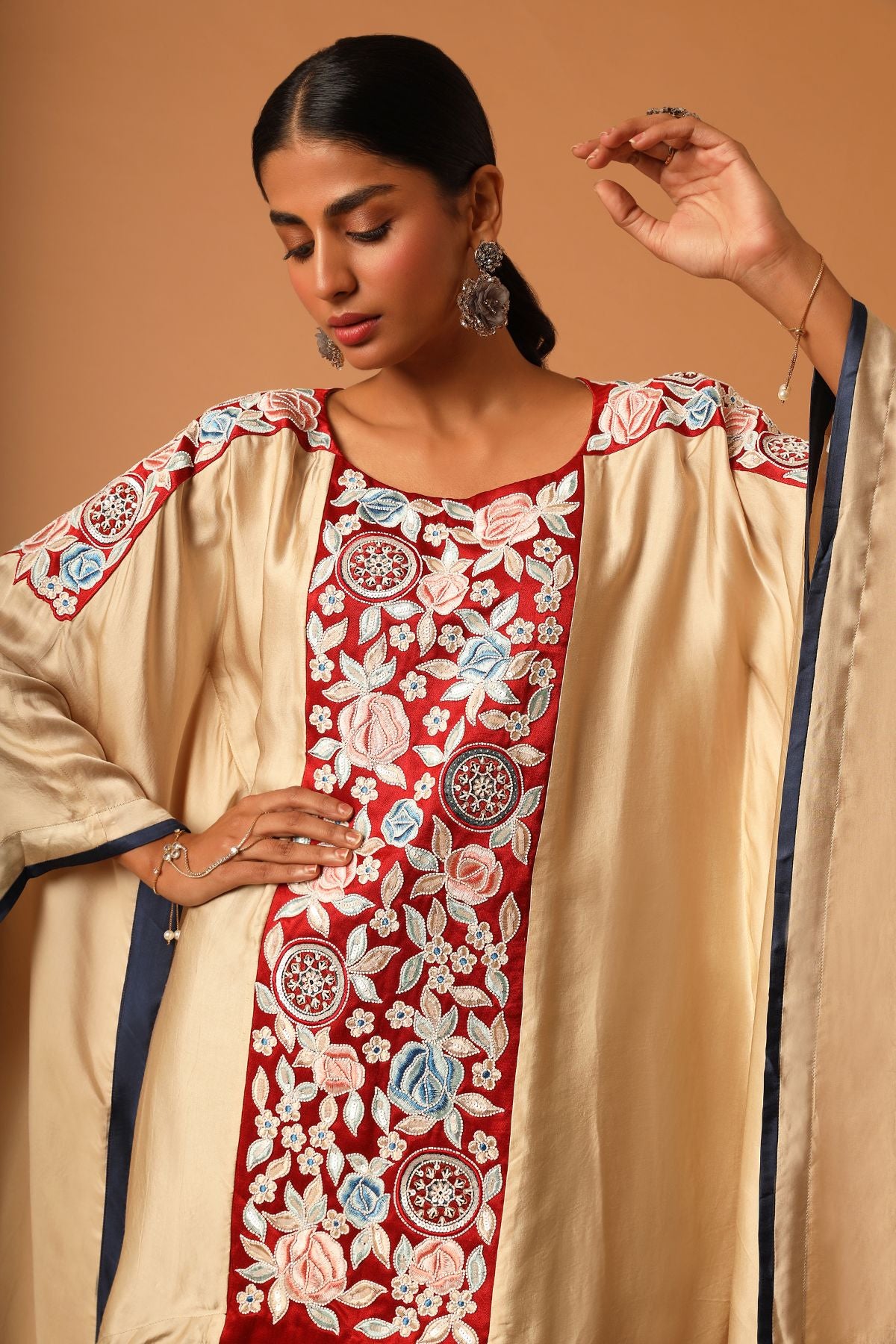 "Elevate your fashion with our asymmetrical handcrafted kaftan paired beautifully with flare pants. Discover unique style today!"