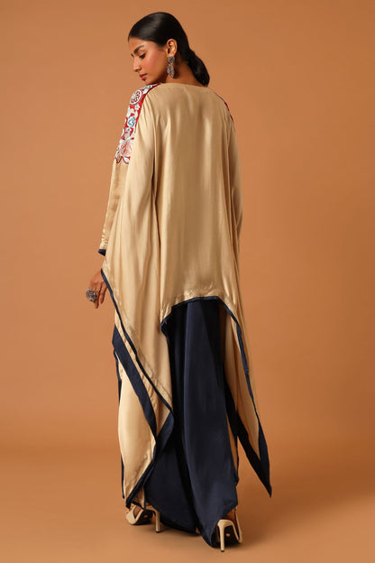 "Elevate your fashion with our asymmetrical handcrafted kaftan paired beautifully with flare pants. Discover unique style today!"