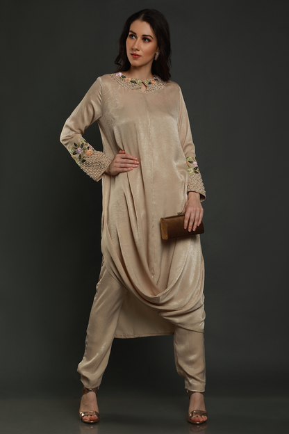 "Elevate your style with our Sand Beige Velvet Crepe Drape Tunic & Pants Set. Hand-embroidered with exquisite details. Perfect for any occasion."