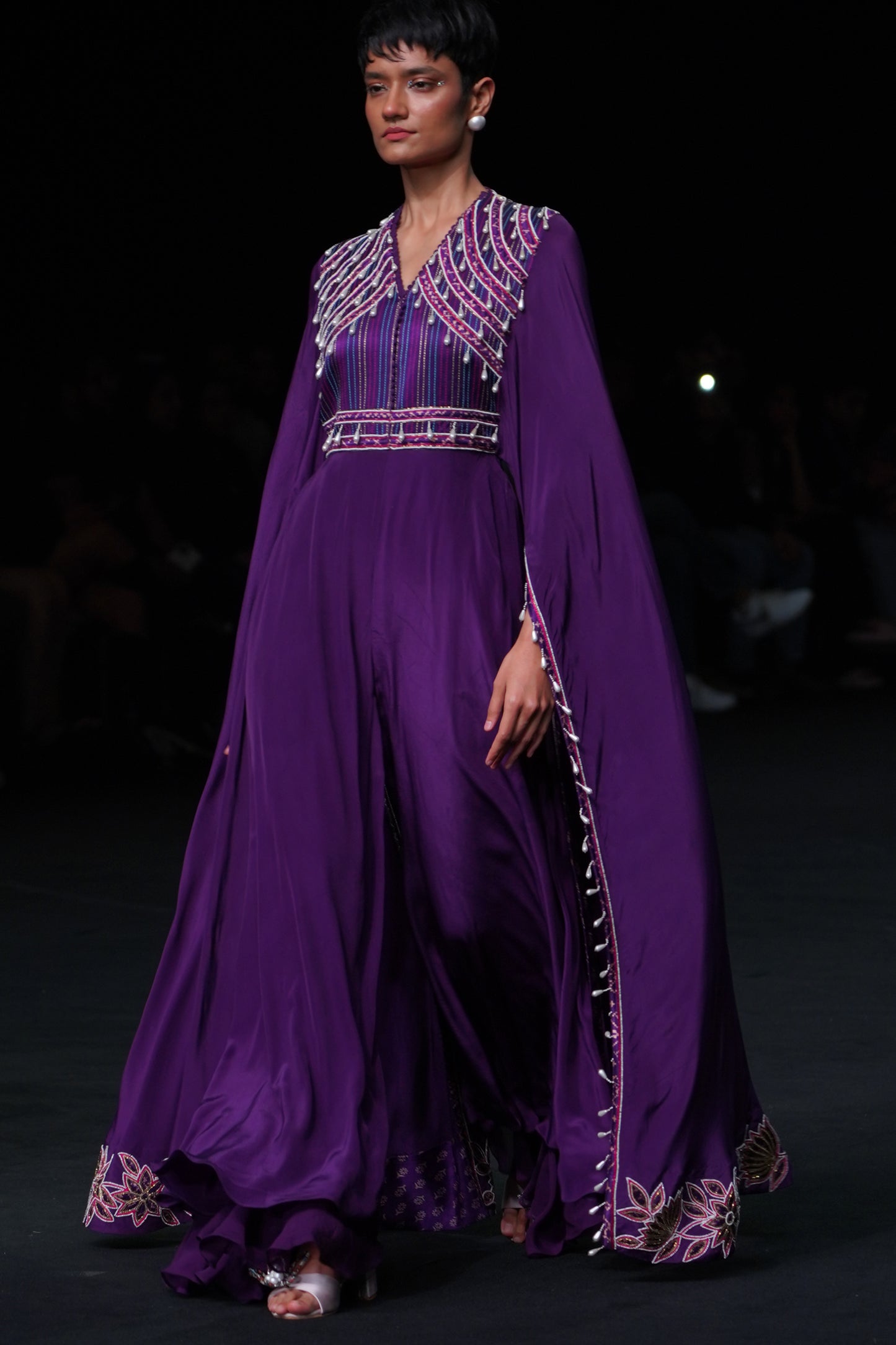 Purple heavily embellished jumpsuit wiwth embroidered cape sleeves