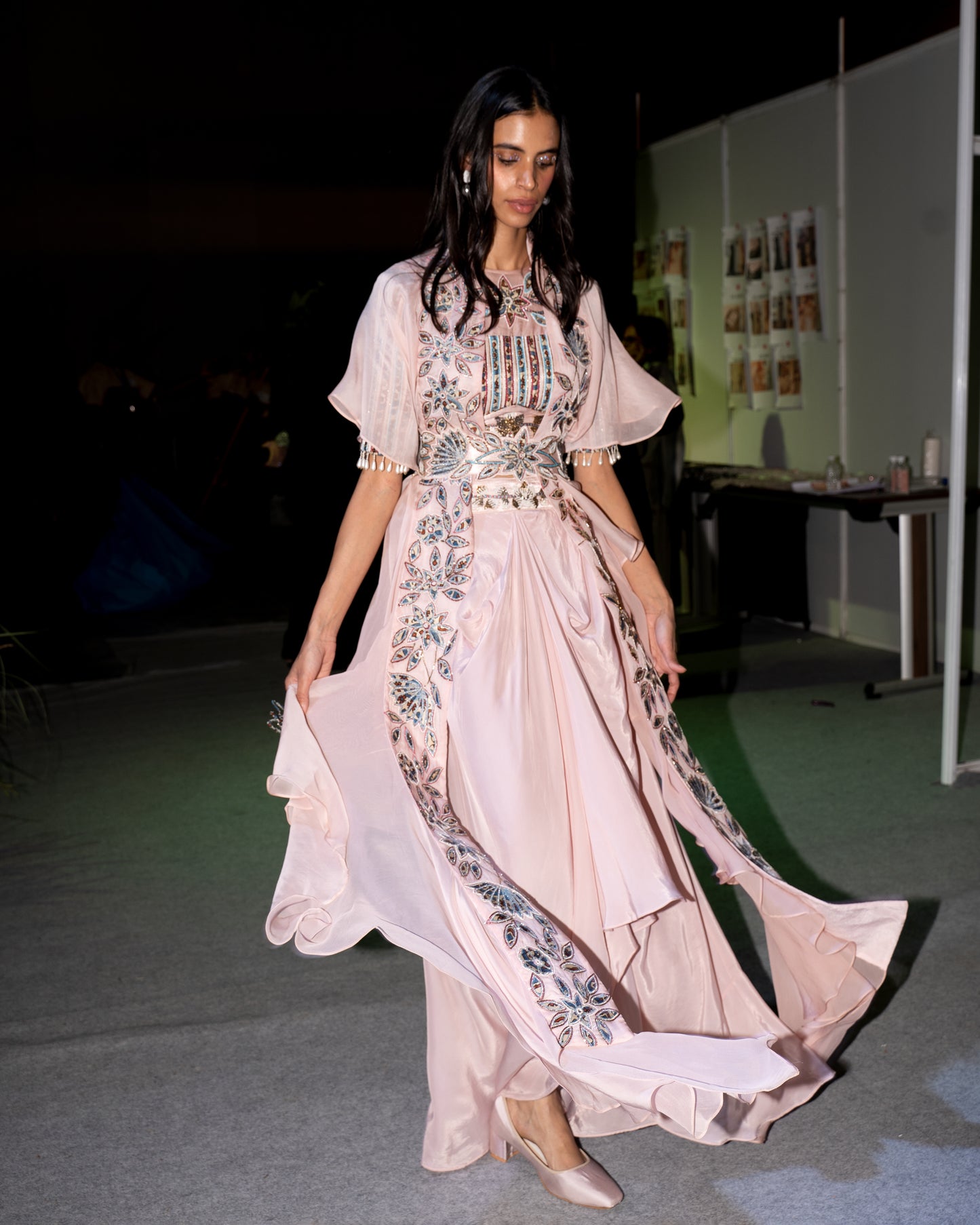 Peachy pink Ajrakh embroidered blouse paired up with Dhoti and ruffled dupatta