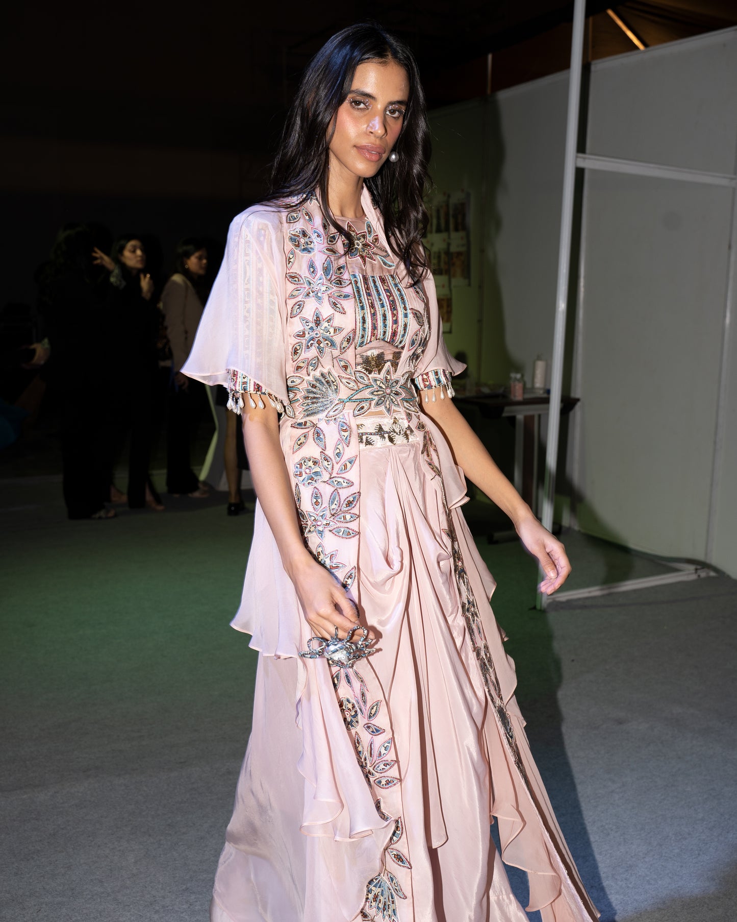 Peachy pink Ajrakh embroidered blouse paired up with Dhoti and ruffled dupatta