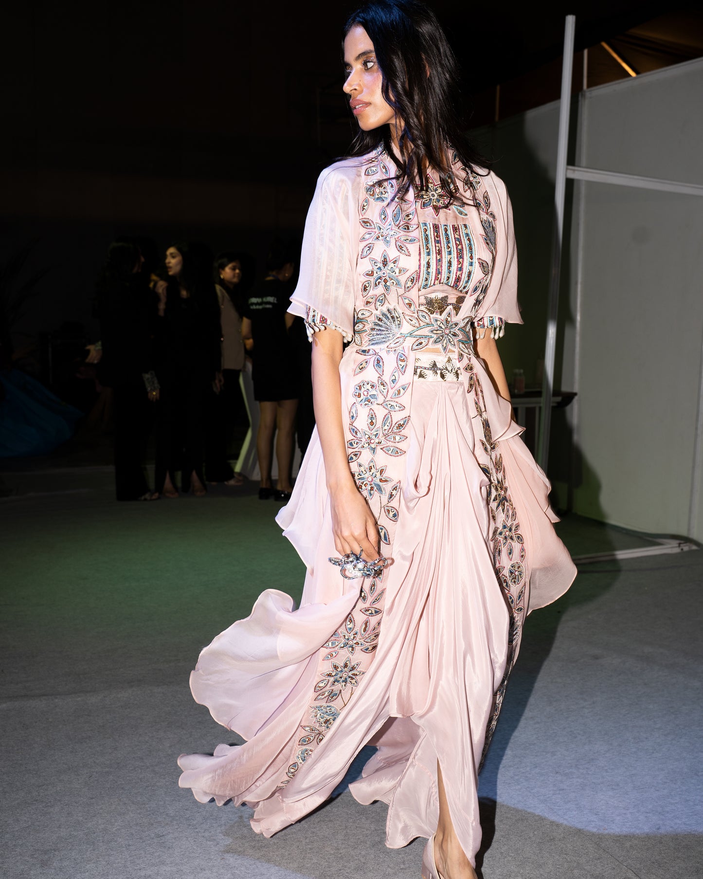 Peachy pink Ajrakh embroidered blouse paired up with Dhoti and ruffled dupatta