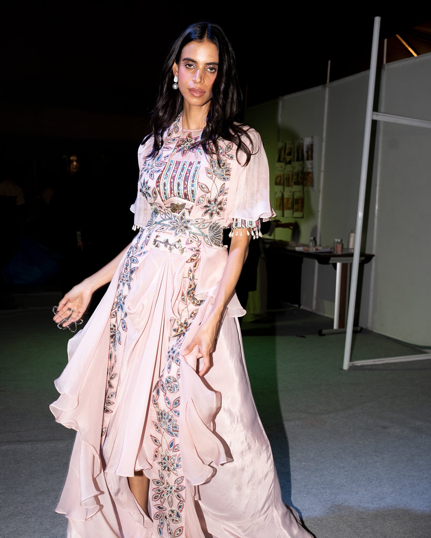 Peachy pink Ajrakh embroidered blouse paired up with Dhoti and ruffled dupatta