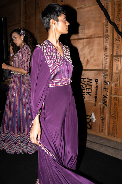 Purple heavily embellished jumpsuit wiwth embroidered cape sleeves