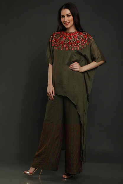 "Stunning bottle green crepe kaftan with threadwork & cutdana embellishments, paired with crepe pants - A perfect blend of style and comfort!"