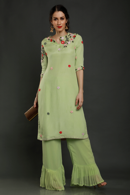 "Stylish crepe mint green kurta paired with pleated palazzo pants & shaded dupatta adorned with intricate threadwork, pearl beads & cutdana - Elegant ensemble!"