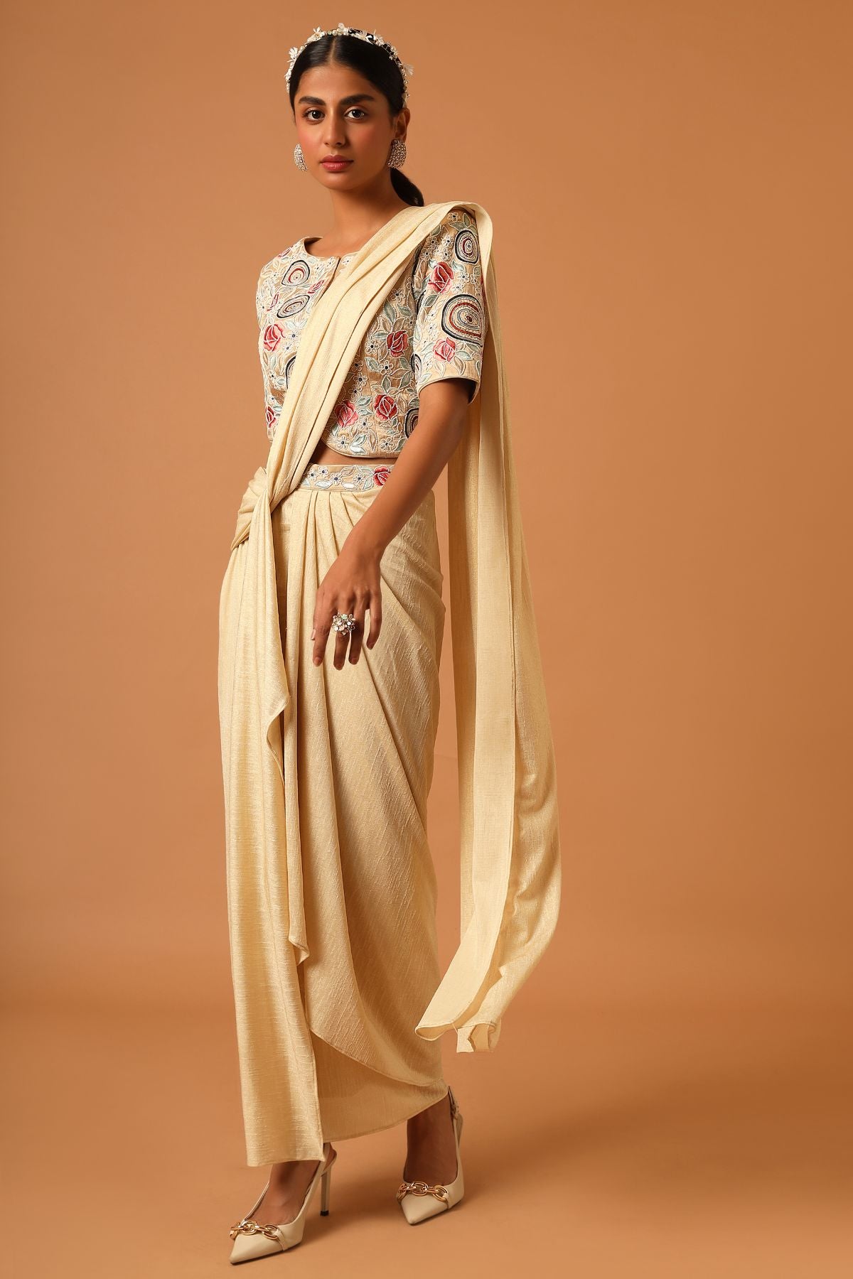 "Elevate your look with our fully embroidered top paired beautifully with a draped skirt. Explore timeless style today!"