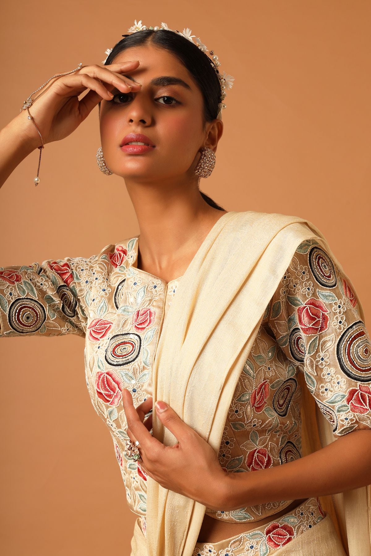 "Elevate your look with our fully embroidered top paired beautifully with a draped skirt. Explore timeless style today!"