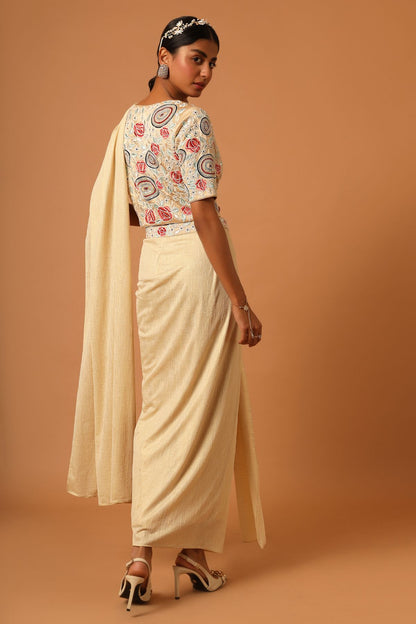 "Elevate your look with our fully embroidered top paired beautifully with a draped skirt. Explore timeless style today!"