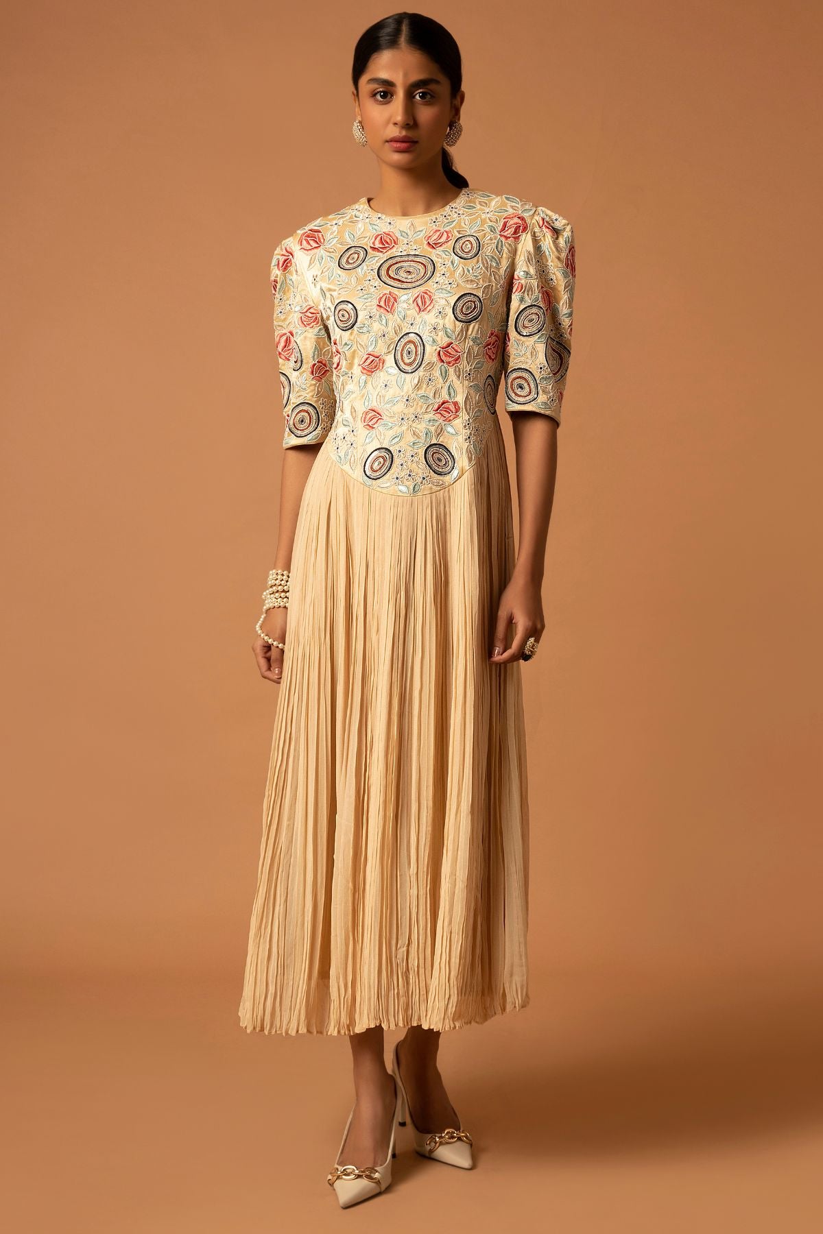 "Exquisite Heavily Embroidered Yoke in Pure Mashru Silk, beautifully attached with the Gathered Skirt in Georgette for a stunning ensemble."