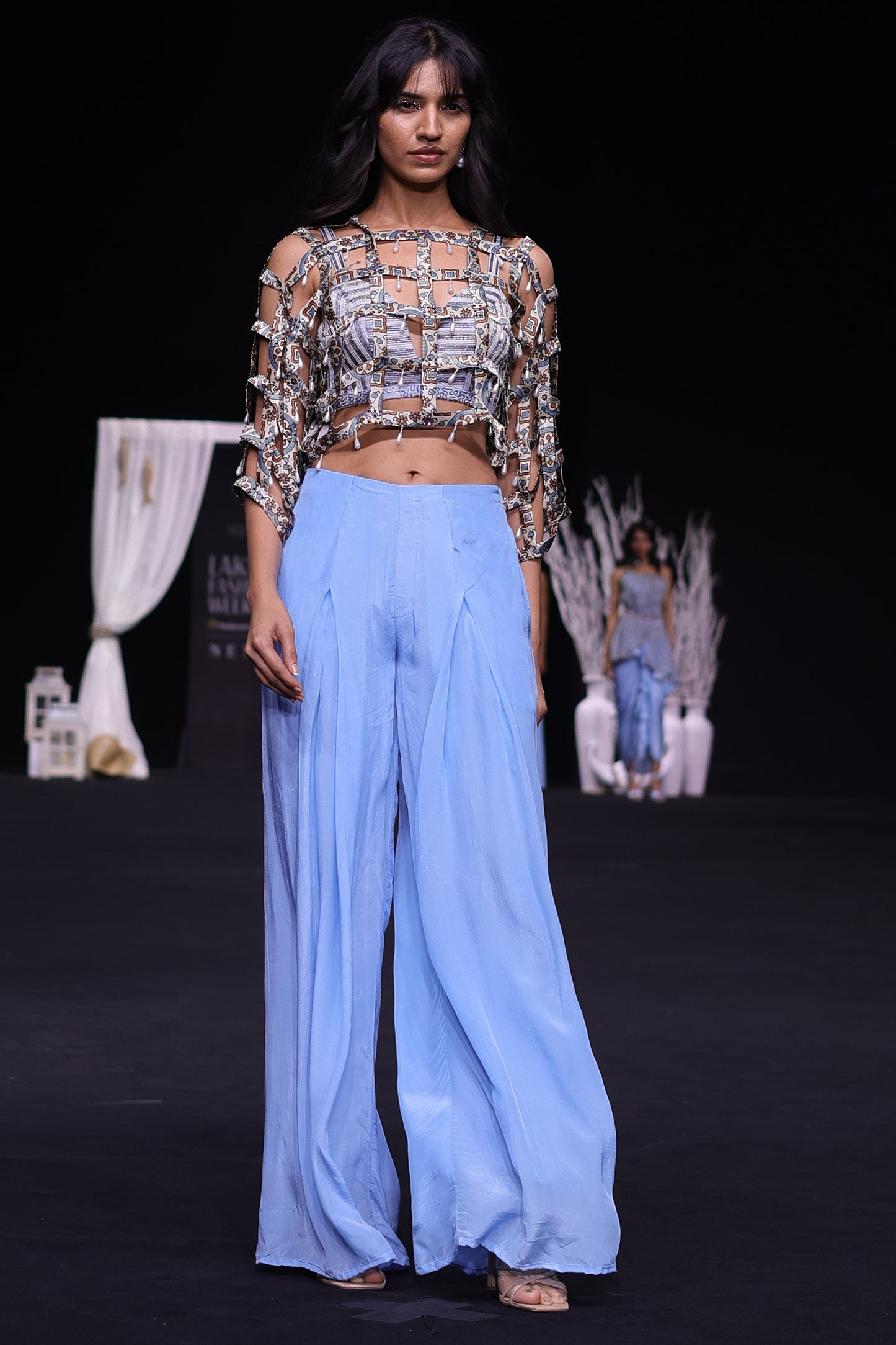 Powder blue ajrakh stripped jacket with embellished brallete and inverted pleated pants