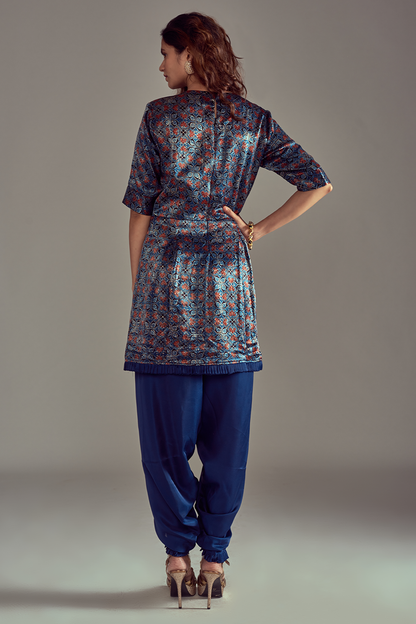 "Charming Cobalt Blue Short Kurti in Mashru Silk Ajrakh Print, adorned with Nakshi Embroidery, perfectly paired with Pleated Dhoti for a graceful look."