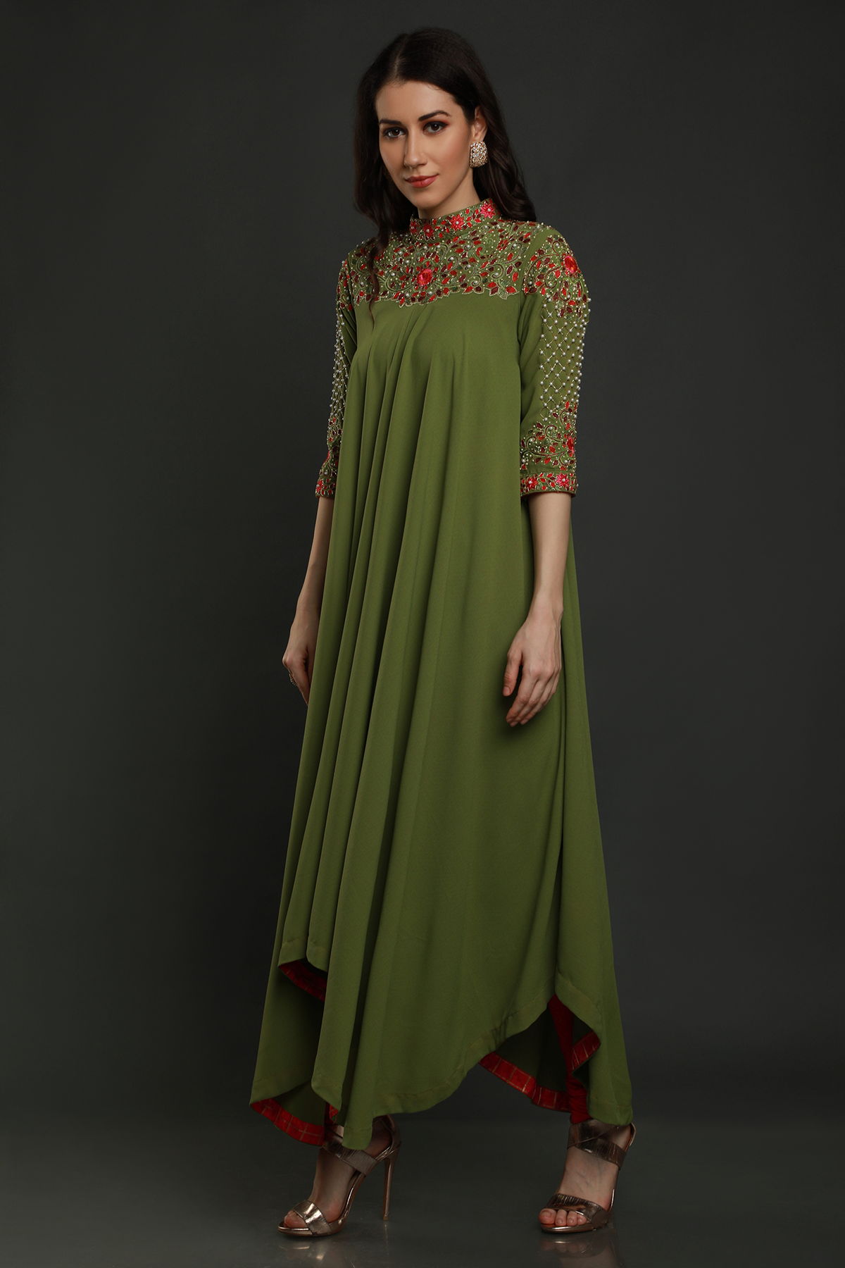 Elevate your elegance in a Mehendi Green Moss Crepe asymmetric maxi dress. Hand-embroidered with thread, pearls, and cut dana work for a unique flair.