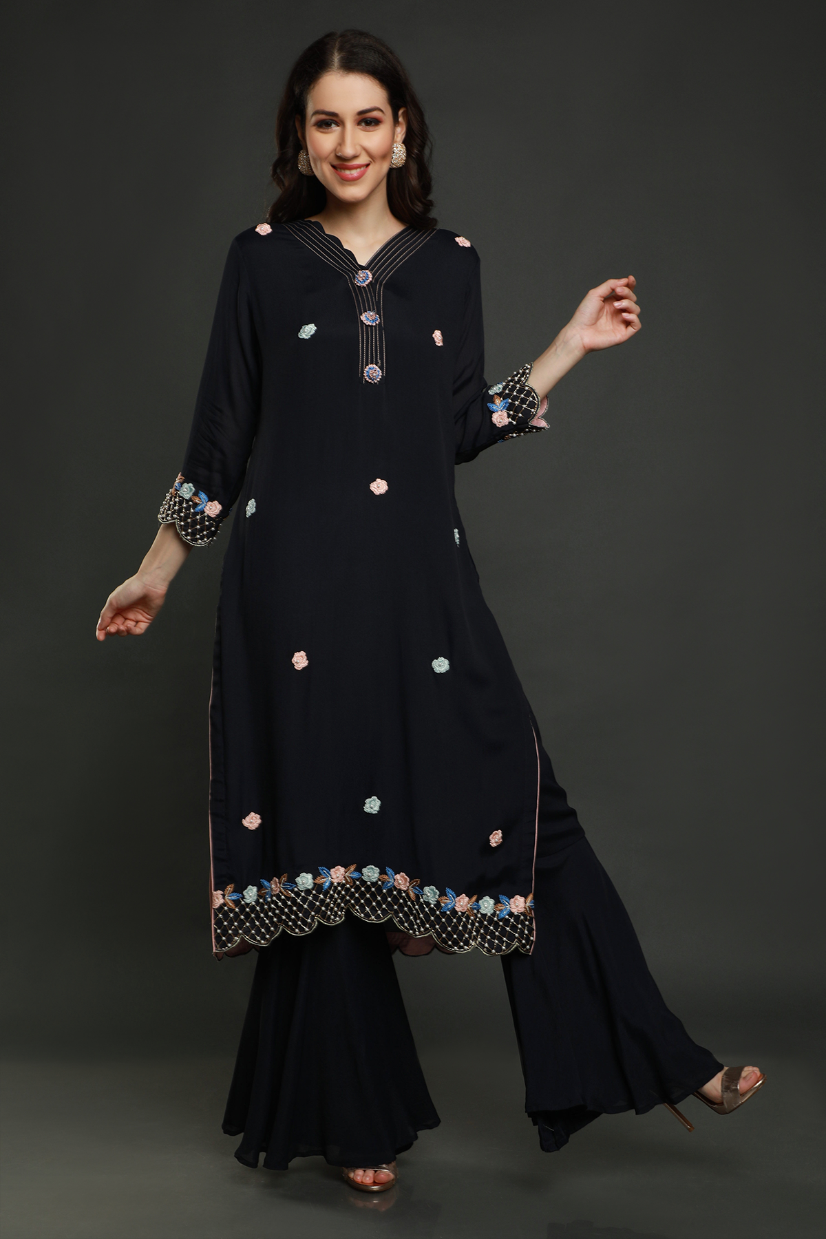 "Exquisite midnight blue crepe kurta paired with flared bottom garara style pants & shaded dupatta adorned with resham thread, moti beads, cutdana work"