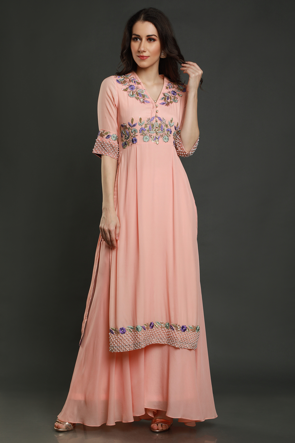 "Chic peach kurta with threadwork, sequins, cutpipe, & bead embellishments, paired with umbrella garara & shaded chiffon dupatta - A stylish fusion outfit!"