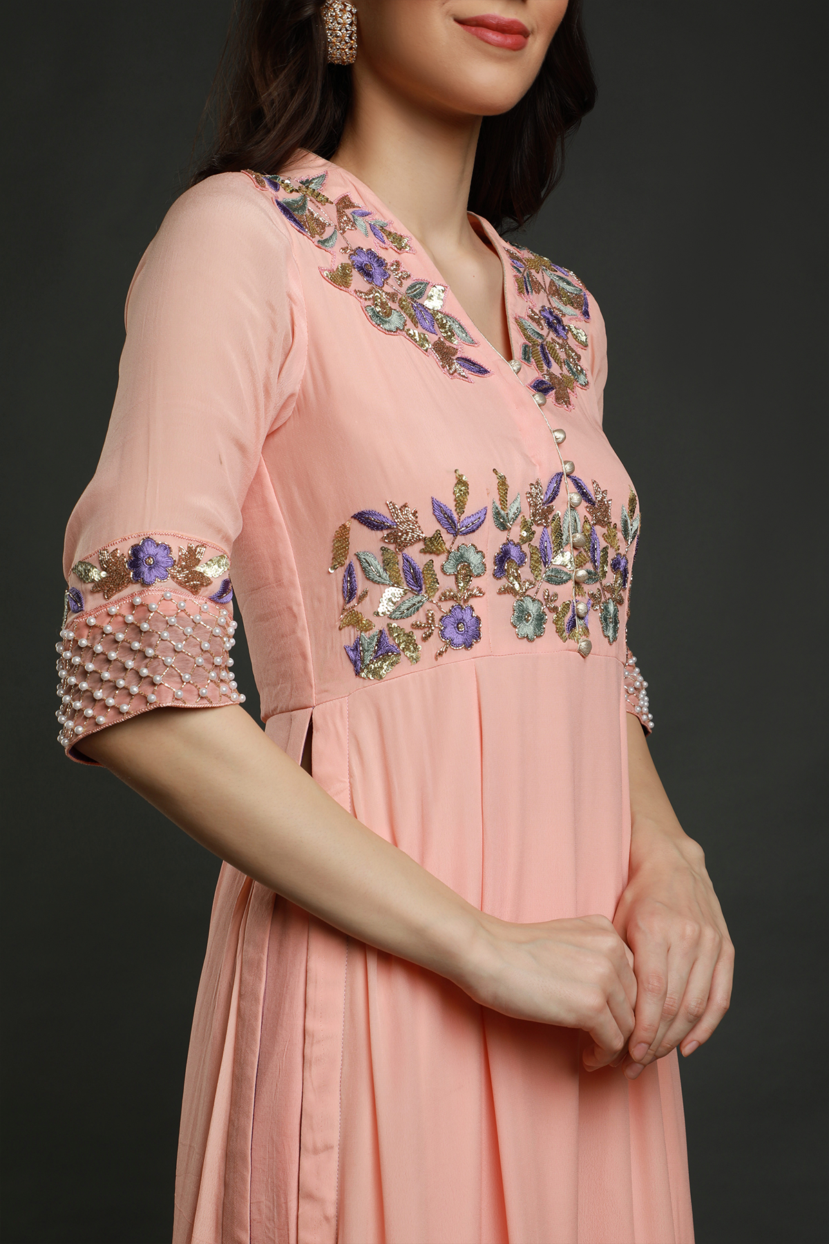 "Chic peach kurta with threadwork, sequins, cutpipe, & bead embellishments, paired with umbrella garara & shaded chiffon dupatta - A stylish fusion outfit!"