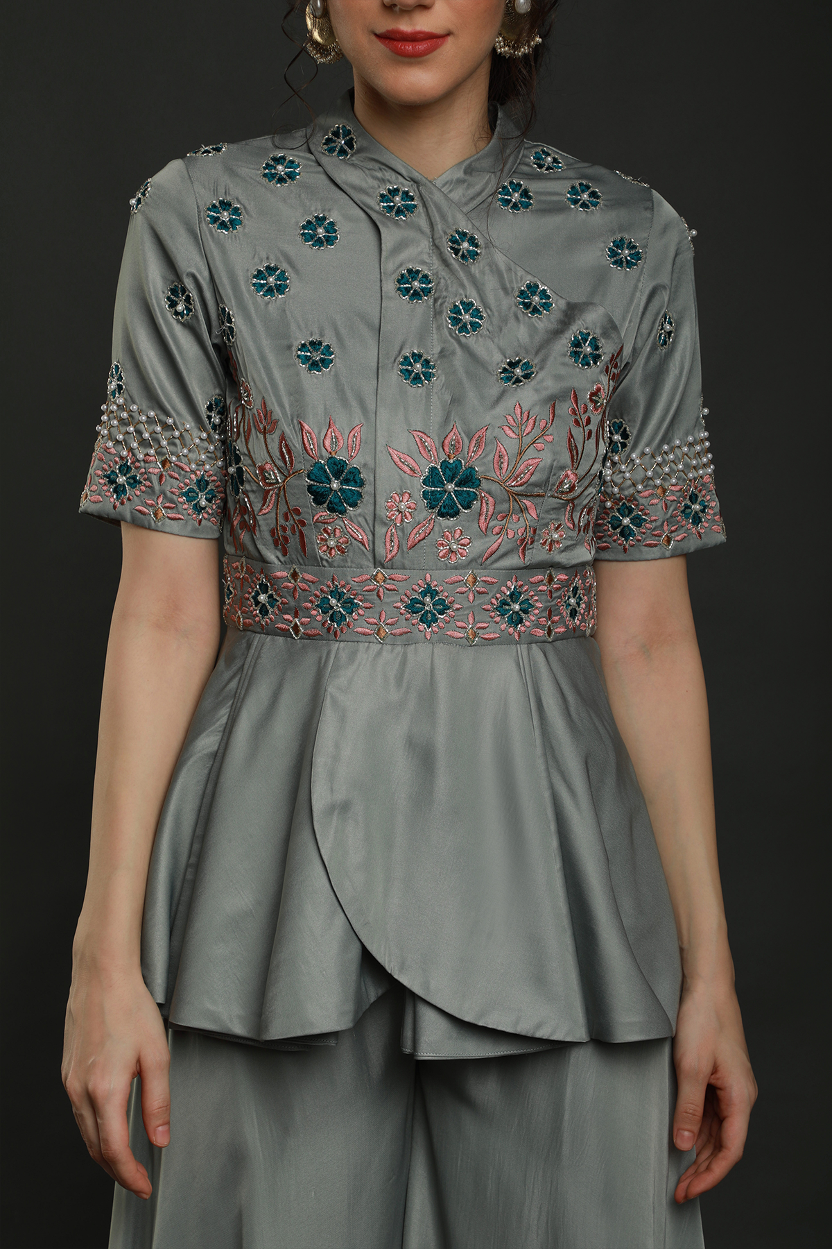 Discover elegance in our Dark Clay Grey satin crepe peplum jumpsuit, adorned with exquisite hand embroidery. Convertible into a top and bottom set.