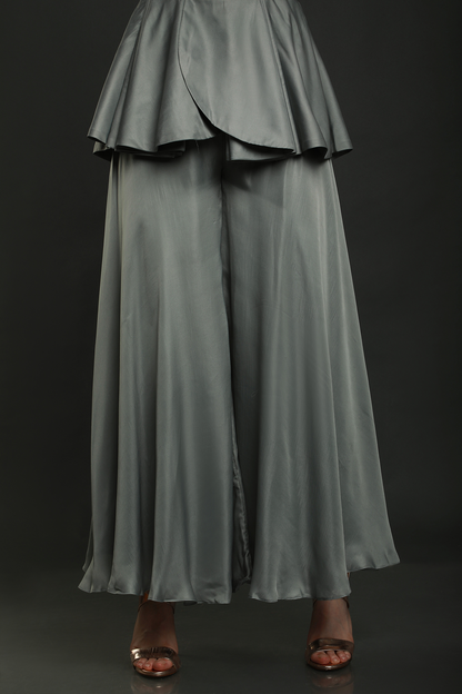 Discover elegance in our Dark Clay Grey satin crepe peplum jumpsuit, adorned with exquisite hand embroidery. Convertible into a top and bottom set.