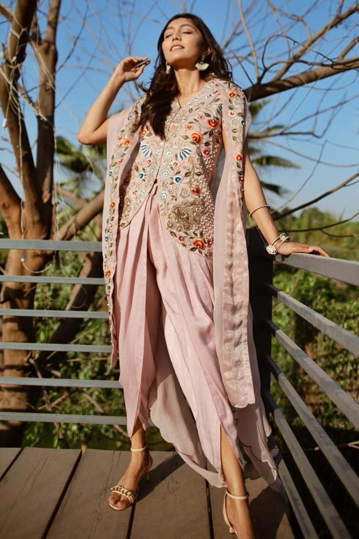 "Elegant Dusky Pink Velvet Crepe Tunic with Intricate Embroidery, paired with Velvet Crepe Dhoti and Organza Dupatta. Shop the luxe ensemble now!"