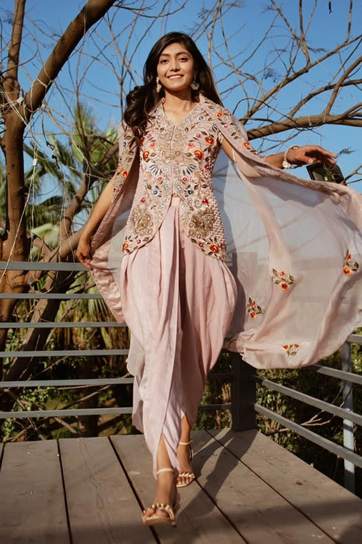 "Elegant Dusky Pink Velvet Crepe Tunic with Intricate Embroidery, paired with Velvet Crepe Dhoti and Organza Dupatta. Shop the luxe ensemble now!"